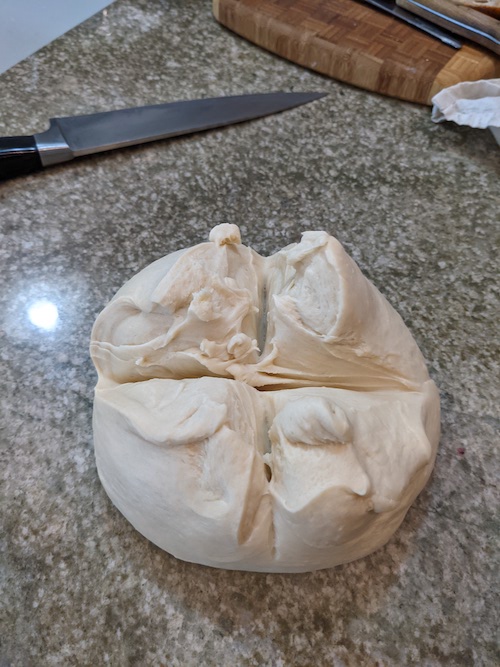 croissant dough after slashes made